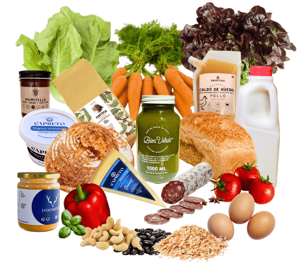 Productos frescos y artesanales de La Comuna: verduras, pan de masa madre, lácteos, caldos, kombucha, charcutería y huevos de granja.