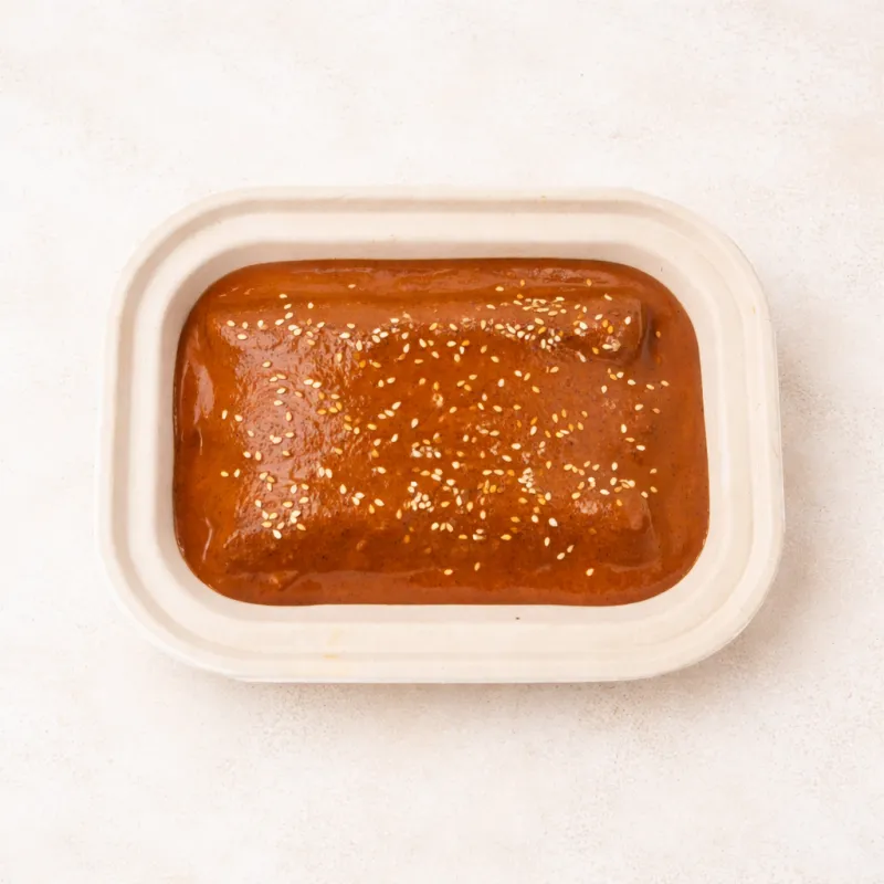 Enmoladas de camote bañadas en mole almendrado con cacao y chiles secos – Ana Ro Foods La Comuna Guadalajara